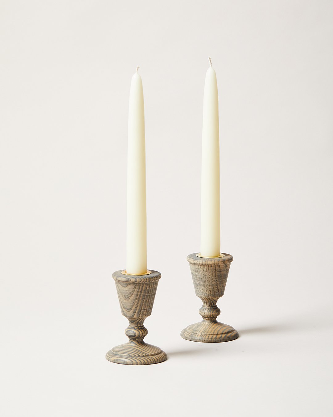 studio image of pair of countryman candlesticks, grey