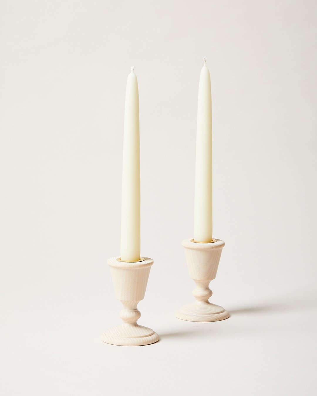 studio image of pair of countryman candlesticks, white