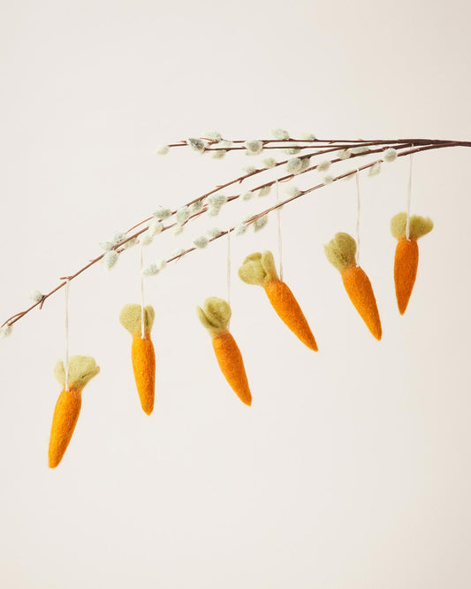 Farmhouse Pottery felted carrot ornaments, set of 6, hanging from a branch
